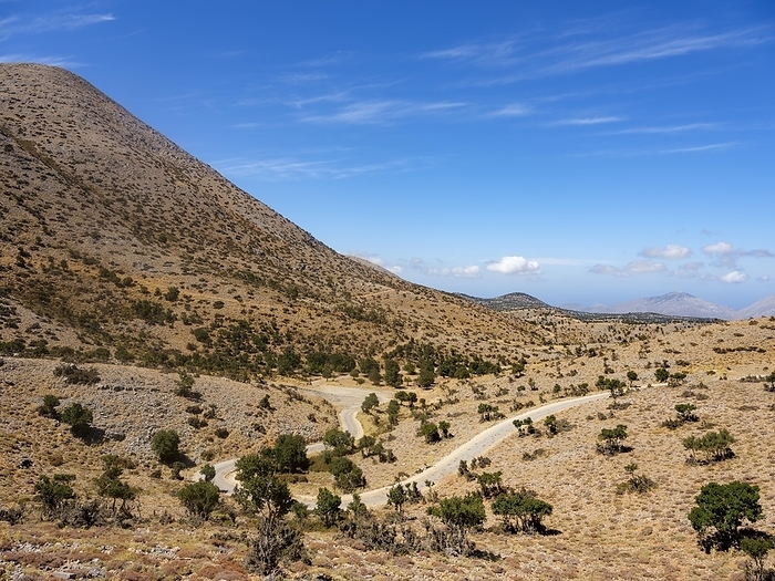 Narrow road winds through karst mountain landscape at Psiloritis, Ida Massif, Crete, Greece, Europe, by Herbert Berger