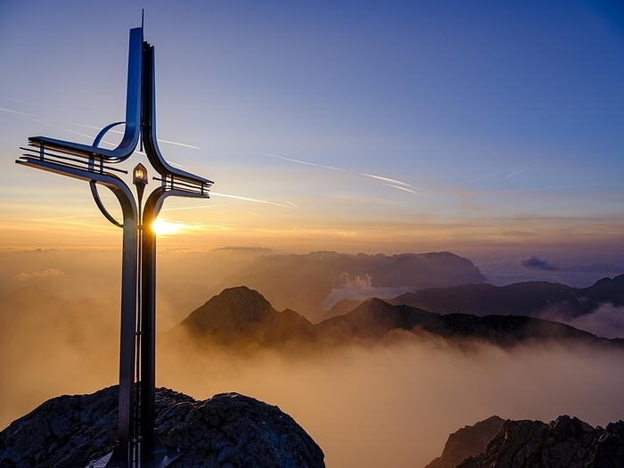 Summit cross Hoher Göll at sunrise, clouds in the valley, Berchtesgaden National Park, Schönau am Königssee, Berchtesgadener Land, Upper Bavaria, Bavaria, Germany, Europe, by Herbert Berger