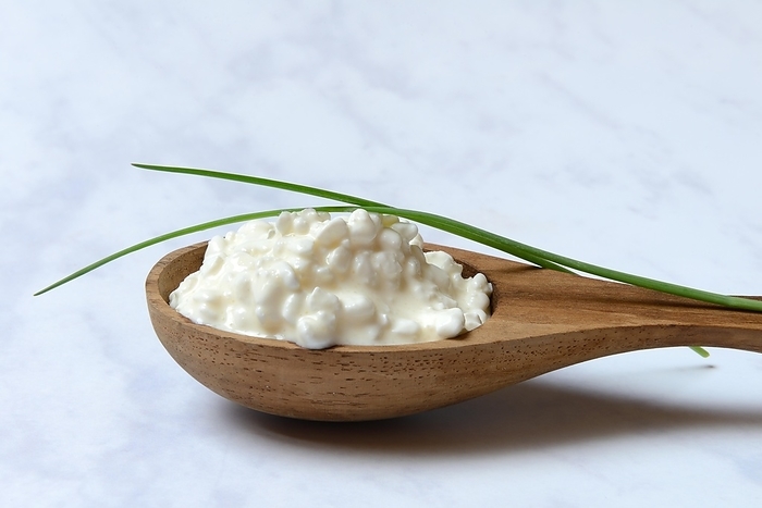 Cream cheese with chives in wooden spoon, Germany, Europe, by Jürgen Pfeiffer