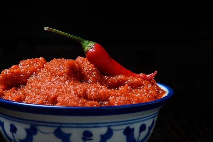 Red Thai curry paste and chili pepper in shell, Germany, Europe, by Jürgen Pfeiffer