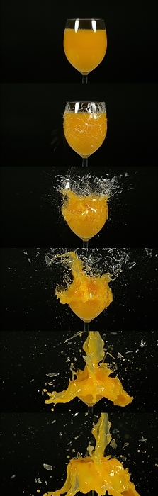 Glass of Orange Exploding against Black Background, by Lacz Gerard