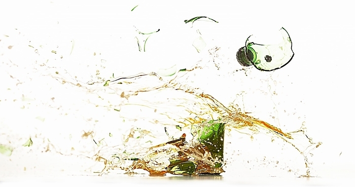 Bottle of Beer Breaking and Splashing against White Background, by Lacz Gerard