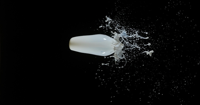 Milk Bouncing and Splashing on Black Background, by Lacz Gerard