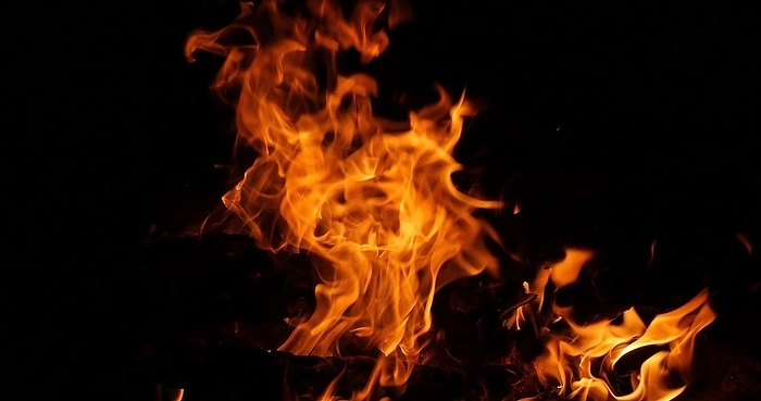 Bonefire, Fire flames in campfire, campsite at Masai Mara Park, Kenya, Africa, by Lacz Gerard