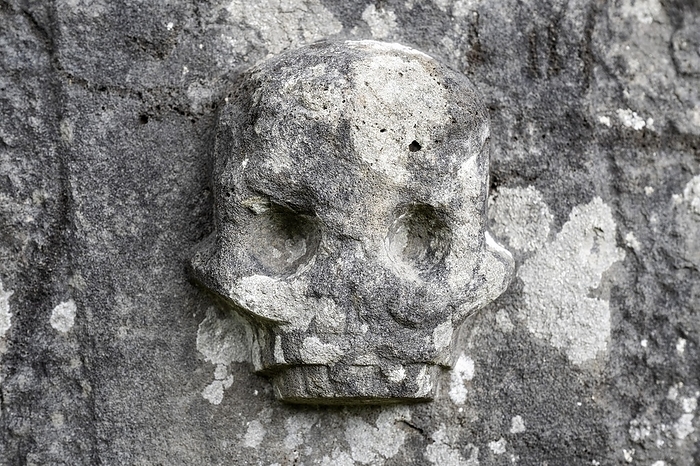 Chiselled skull as decoration on an old weathered gravestone, Kilmartin, Argyll and Bute, Scotland, Great Britain, by Markus Keller