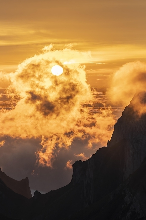 Sunrise, sun shining over mountains in fog, Säntis, Appenzell Ausserrhoden, Appenzell Alps, Switzerland, Europe, by Moritz Wolf