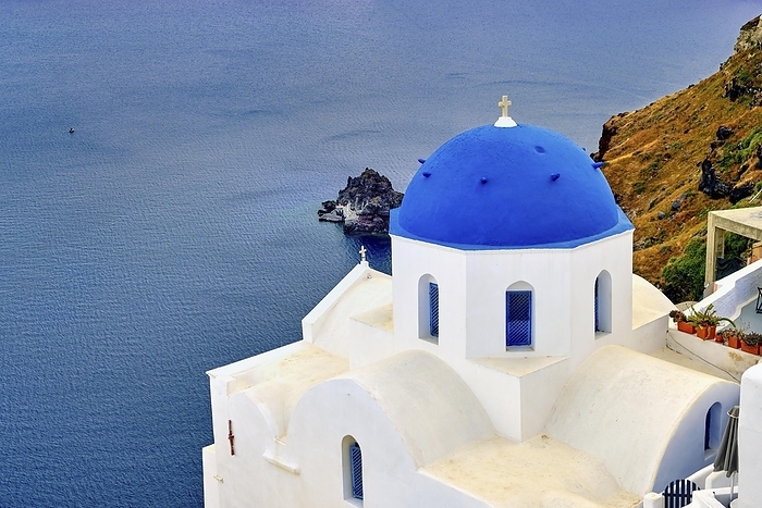Beautiful view of Santorini island village or town, Greece. Whitewashed houses and churches, blue dome, sea waters of caldera bay, rough cliffs. Famous tourist attraction, romantic travel destination, summer vacations, by Natallia Pershaj