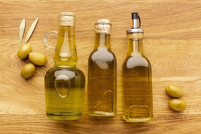 Close up olive bottles yellow olives leaves, by Oleksandr Latkun