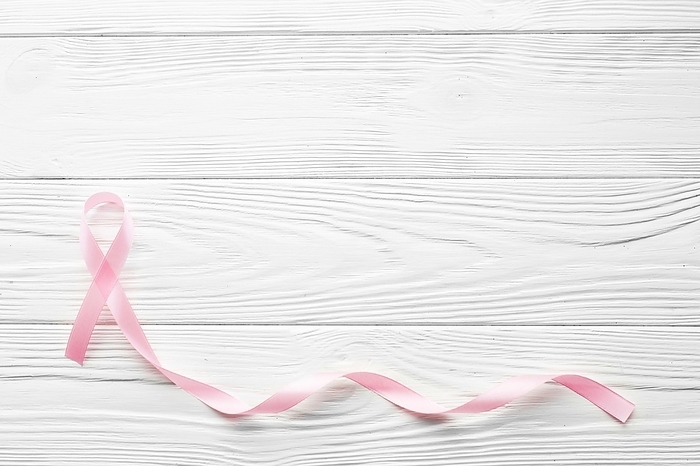 Long pink ribbon wooden background, by Oleksandr Latkun