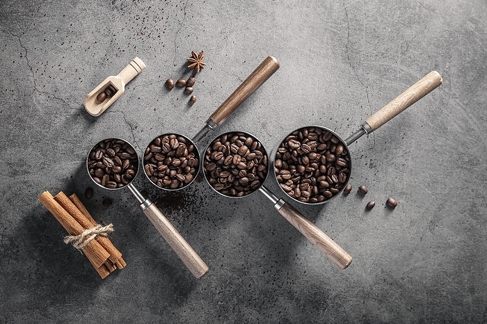 Top view coffee beans cups with scoop cinnamon sticks, by Oleksandr Latkun