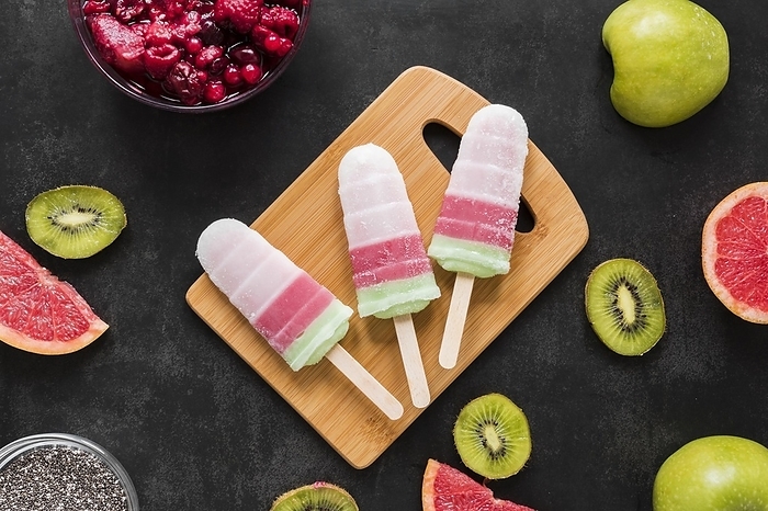 Top view delicious popsicles with fruit, by Oleksandr Latkun
