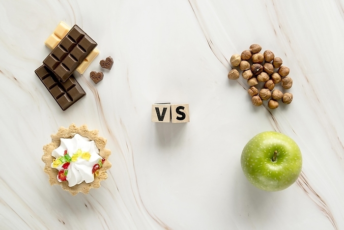 Unhealthy creamy tart chocolate vs healthy hazelnut apple texture background, by Oleksandr Latkun