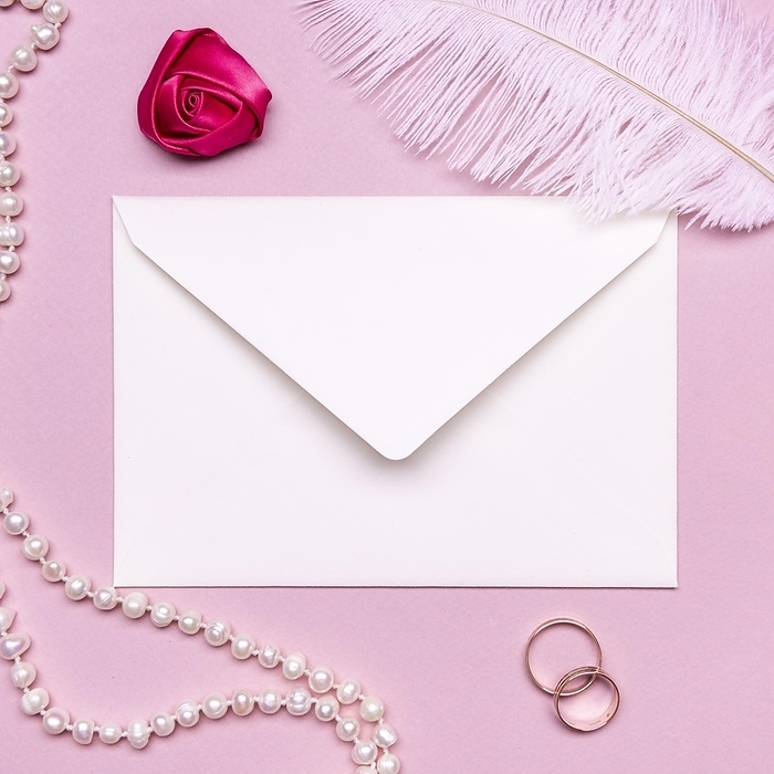 Elegant envelope surrounded by pearls wedding rings, by Oleksandr Latkun