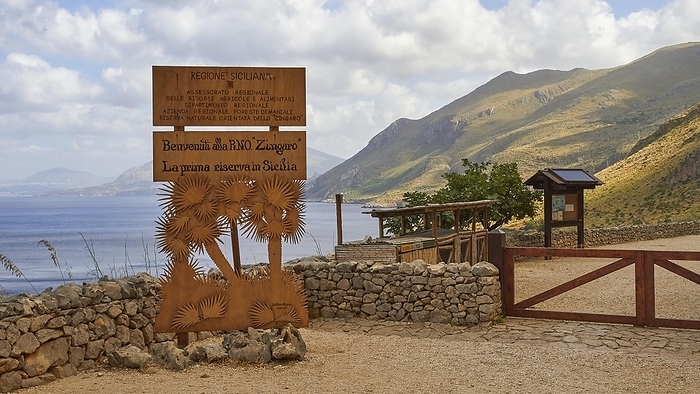 Welcome sign, stone wall, green mountains, cloudy sky, Zingaro, national park, nature reserve, northwest, Sicily, Italy, Europe, by Ralf Adler