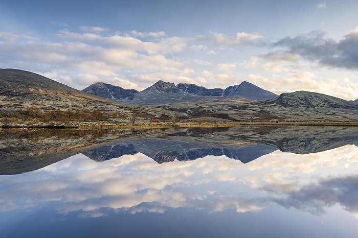 Reflection of the autumn landscape in Rondane National Park, mountains Høgronden, Midtronden and Digerronden Dørålen, Dørålseter, Norway, Europe, by Robert Haasmann