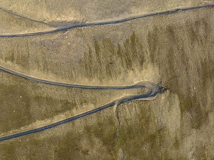 Gravel road with narrow switchbacks leads to the summit of Monte Jafferau, Forte Jafferau, drone shot, aerial photo, Bardonecchia, Piedmont, Italy, Europe, by Michael Szönyi