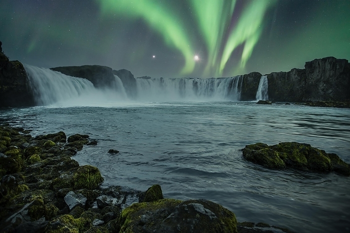 Iceland Godafoss waterfall on a night with a beautiful Northern Lights. Iceland, by Unai Huizi