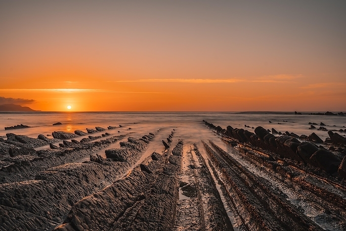 Sunset in Sakoneta, it is a beach in Deba. It is the western end of the Geopark of the Basque Coast, Guipuzkoa, Basque Country. The incredible Flysch, by Unai Huizi