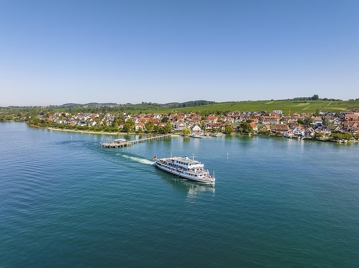 Aerial view of the Lake Constance municipality of Hagnau with the landing stage and the departing scheduled ship MS Swabia of the Lake Constance-Schiffsbetriebe, Weiße Flotte, Lake Constance district, Baden-Württemberg, Germany, Europe, by Markus Keller