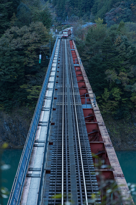 Japan Trolley train running on the railway bridge over Oku-Oi Lake Station in Kawane-Honmachi, Haibara-gun, Shizuoka Prefecture, Japan
