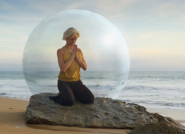 Mature Woman Doing Yoga In A Bubble By The Seashore, by Ben Welsh / Design Pics