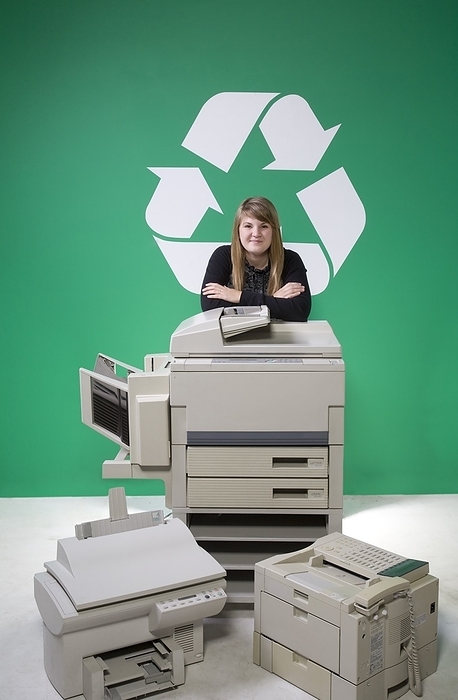 Woman Recycling Copiers, by Design Pics RF / Design Pics
