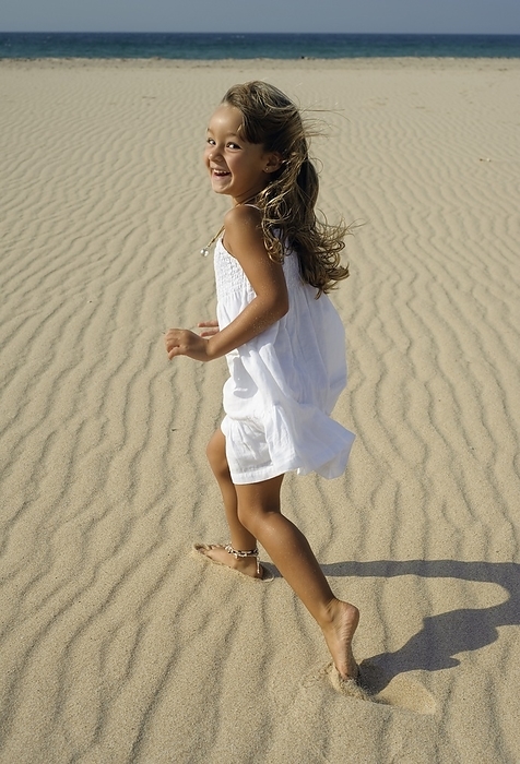Young Girl Running On Beach, by Ben Welsh / Design Pics
