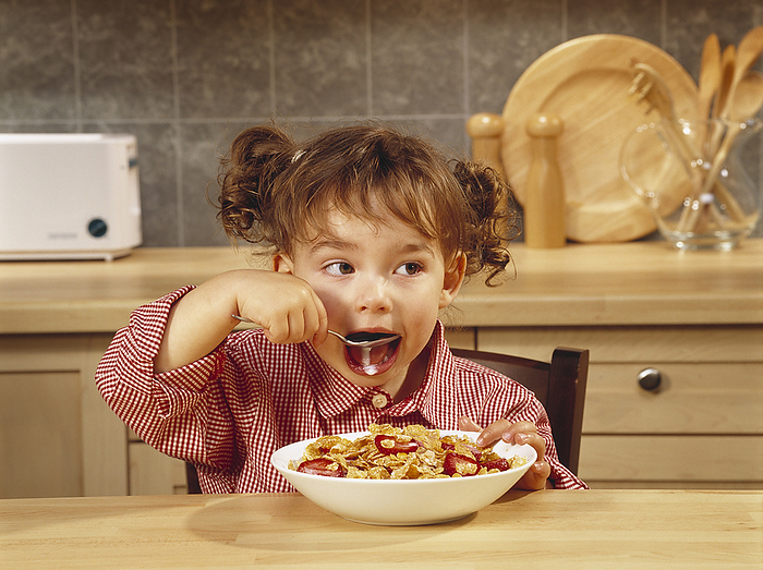 Fv4071, Matthew Plexman; Girl Eating Bowl Of Cereal With Strawberries, by Matthew Plexman / Design Pics