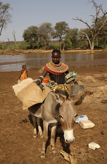 Kenya Samburu Collecting River Water  Xa  Sasaab Kenya, by Chris Caldicott   Design Pics