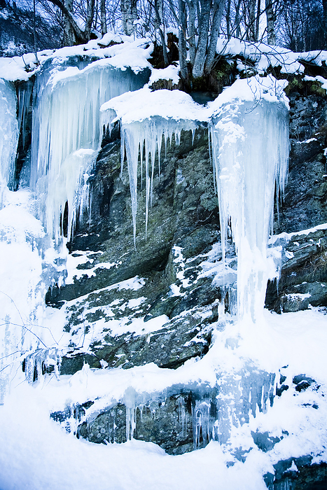 Norway Icicles At The Roadside From A Frozen Stream And Waterfall Caught In Stasis, Contrasting Against The Dark Rocks  Ortnevik, Sognefjord, Norway, by Naki Kouyioumtzis   Design Pics