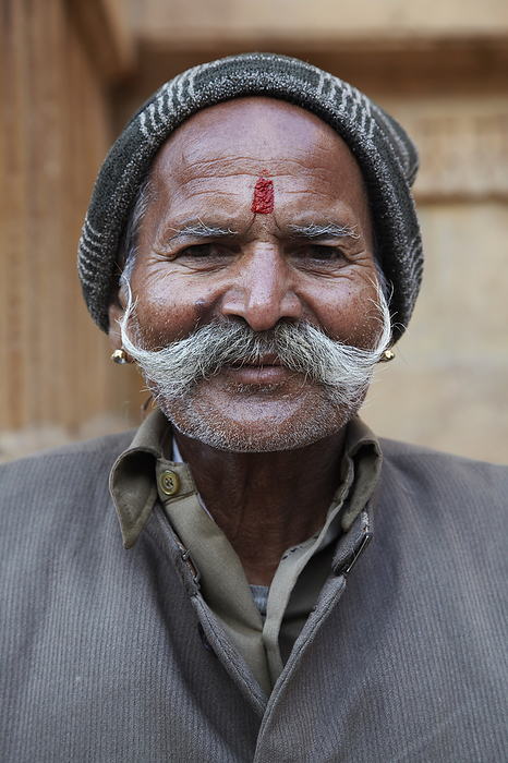 Jaisalmer, India Man sat outside temple Jaisalmer Rajasthan India, by Andy Kerry   Design Pics