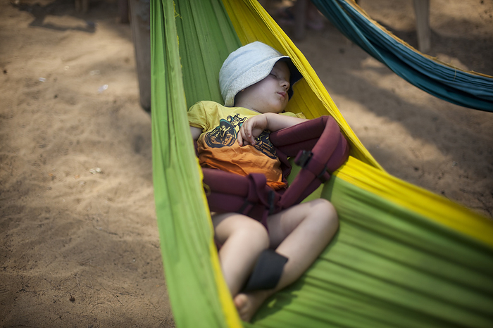 India Rudi Mchugh sleeps happily in a hammock on Turtle Beach, Goa, India., by Vicki Couchman   Design Pics