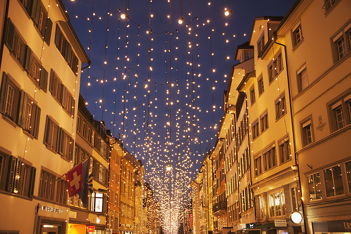 Zurich, Switzerland Small White Lights Strung Over A City Street At Christmastime  Zurich City, Zurich, Switzerland, by Lars Froelich   Design Pics