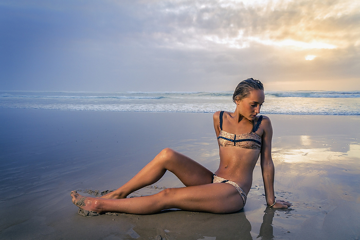 Australia Young Woman In A Bikini On Tallows Beach At Sunrise  New South Wales, Australia, by Brook Mitchell   Design Pics
