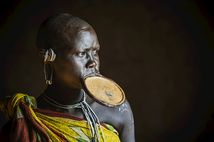 Ethiopia Woman From The Suri  Surma  Tribe With Traditional Clay Lip Plate, Omo Region, Southwest Ethiopia  Kibish, Ethiopia, by Toby Adamson   Design Pics