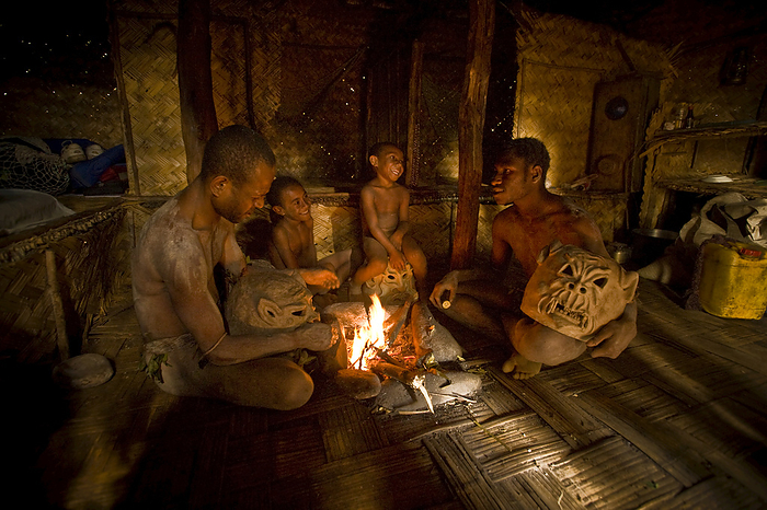 Papua New Guinea Goroka Mudmen Gathered Around A Fireplace  Goroka, Eastern Highlands, Papua New Guinea, by David Kirkland   Design Pics