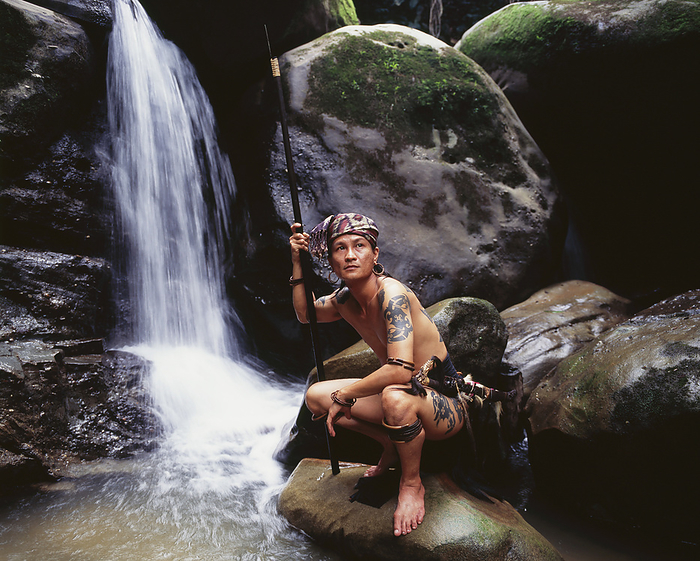 Pausing By A Waterfall, Near Kuching; Sarawak, by David Kirkland / Design Pics