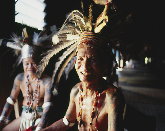 Village Men Wearing Traditional Dress In River Longhouse; Sarawak, by David Kirkland / Design Pics