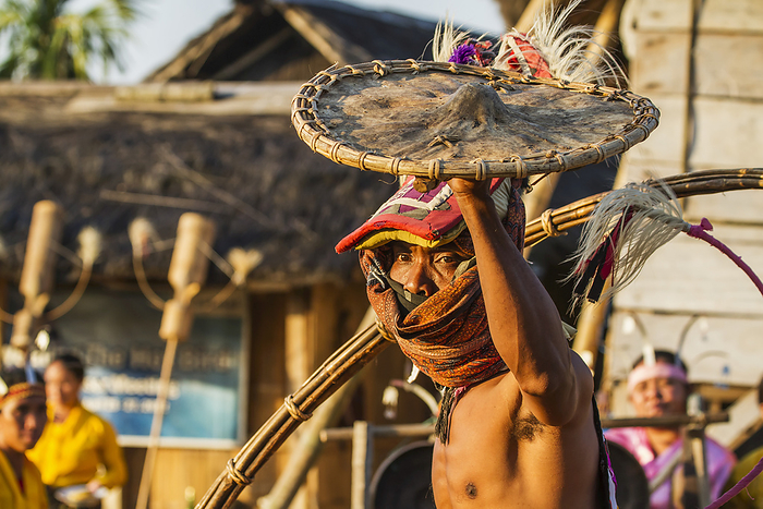 Indonesia Manggarai Man Wearing A Traditional Headdress Wrapped With Cloth Wielding A Shield And Bamboo Whip In A Caci, A Ritual Whip Fight, Melo Village, Flores, East Nusa Tenggara, Indonesia, by Peter Langer   Design Pics