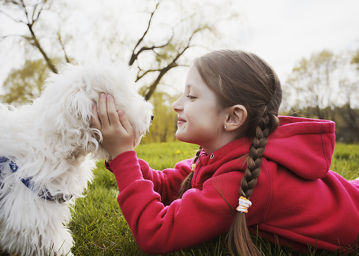 Portrait Of Young Girl And Puppy At A Park; Toronto, Ontario, Canada, by Vast Photography / Design Pics
