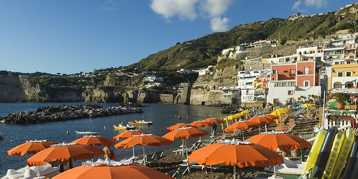 Italy Colourful Buildings And Orange Umbrellas On A Beach At A Resort Along The Coastline Of The Island Of Ischia  Ischia, Campania, Italy, by Keith Levit   Design Pics