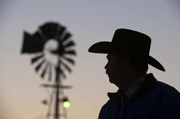 America Silhouette of a Nebraska rancher wearing a cowboy hat at sunset in the Nebraska Sandhills  Sandhills, Nebraska, United States of America, by Joel Sartore Photography   Design Pics