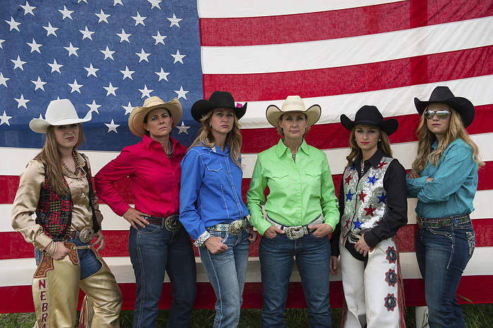America Rodeo queens pose for a portrait in front of an American flag  Burwell, Nebraska, United States of America, by Joel Sartore Photography   Design Pics