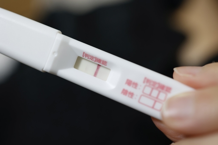 Over-the-counter pregnancy test with a faint positive line