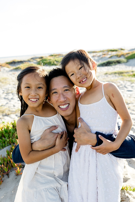 Asian Father & Daughters on Beach at Sunset in San Diego, by Cavan Images / Jill Denny Soto