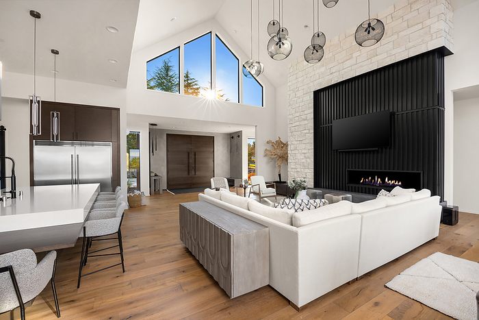 Living room, kitchen, and foyer in new contemporary style luxury home, by Cavan Images / Justin Krug