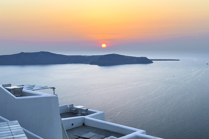 Terrace with blue sky on the Greek island of Santorini, by Cavan Images / Hernán Pagano