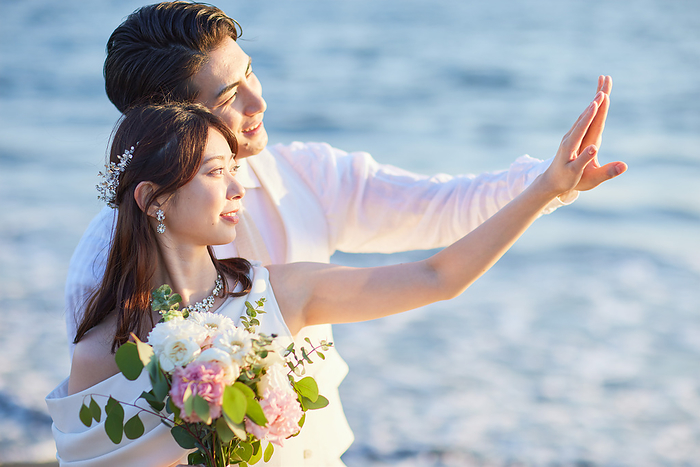 Japanese bride and groom looking at rings