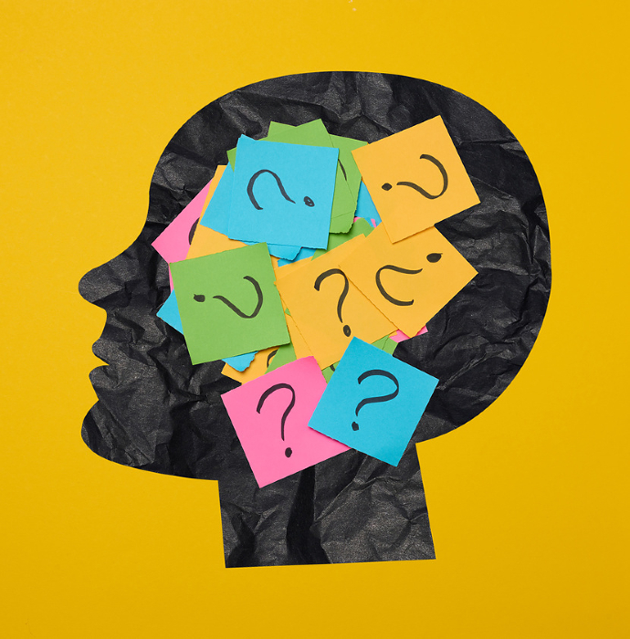 Silhouette of a person s head with a sticker inside, featuring drawn question marks, symbolizing the concept of searching for truth. Silhouette of a person s head with a sticker inside, featuring drawn question marks, symbolizing the concept of searching for truth.