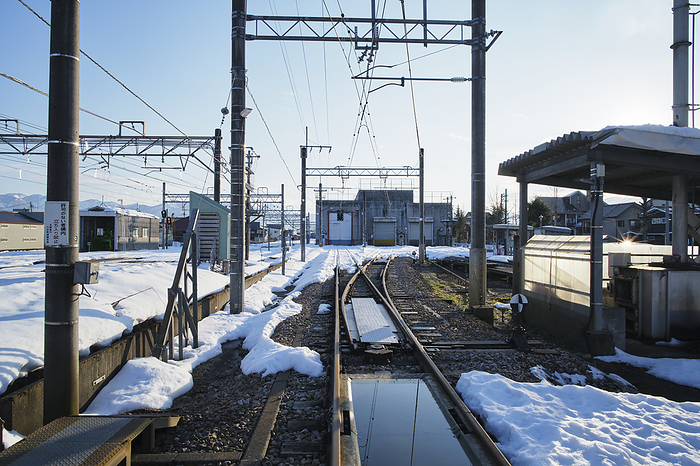 Photo taken in 2024. Railroad crossing during snowfall. January 2024 Minamiuonuma City, Niigata Prefecture